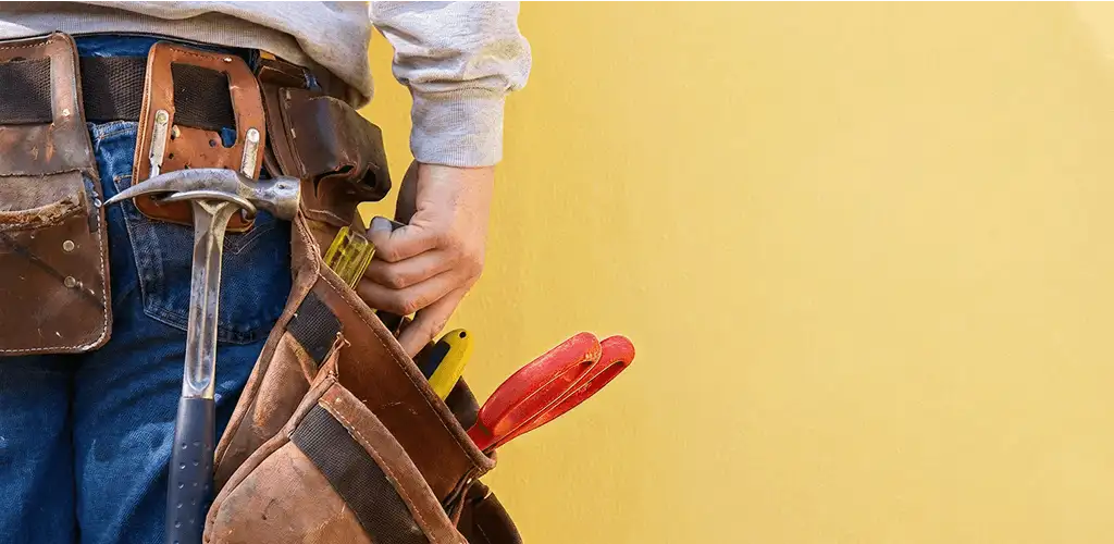 Handyman with tool belt ready for home repairs and maintenance in Fort Lauderdale, FL