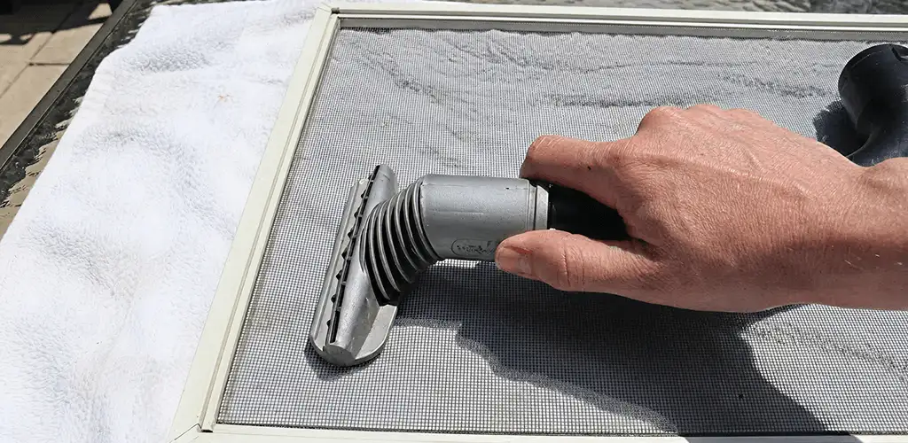 Window screen repair cleaning and fixing a damaged screen mesh in Fort Lauderdale, FL