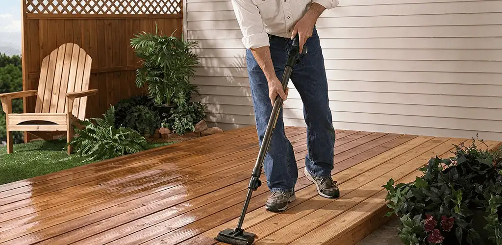 Deck staining service applying stain to a backyard wood deck in Fort Lauderdale, FL